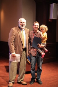 award winner with child