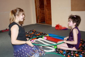 Britta teaches one of IRODA's children with circus therapy.