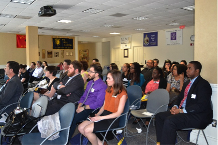 The audience watches the MA thesis presentations.