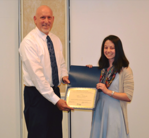 man and woman posing with award