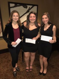 three girls posing with awards