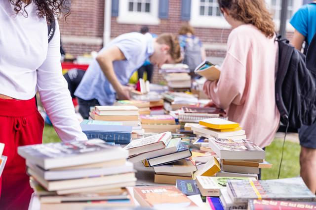 piles of books on a table