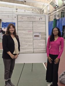 Dr. Marla Jaksch (Left) and Ebony Riley (Right) presenting the poster titled "Digitizing Apartheid Heritages"