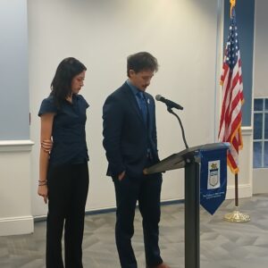 Two HSS Students speaking at the podium.
